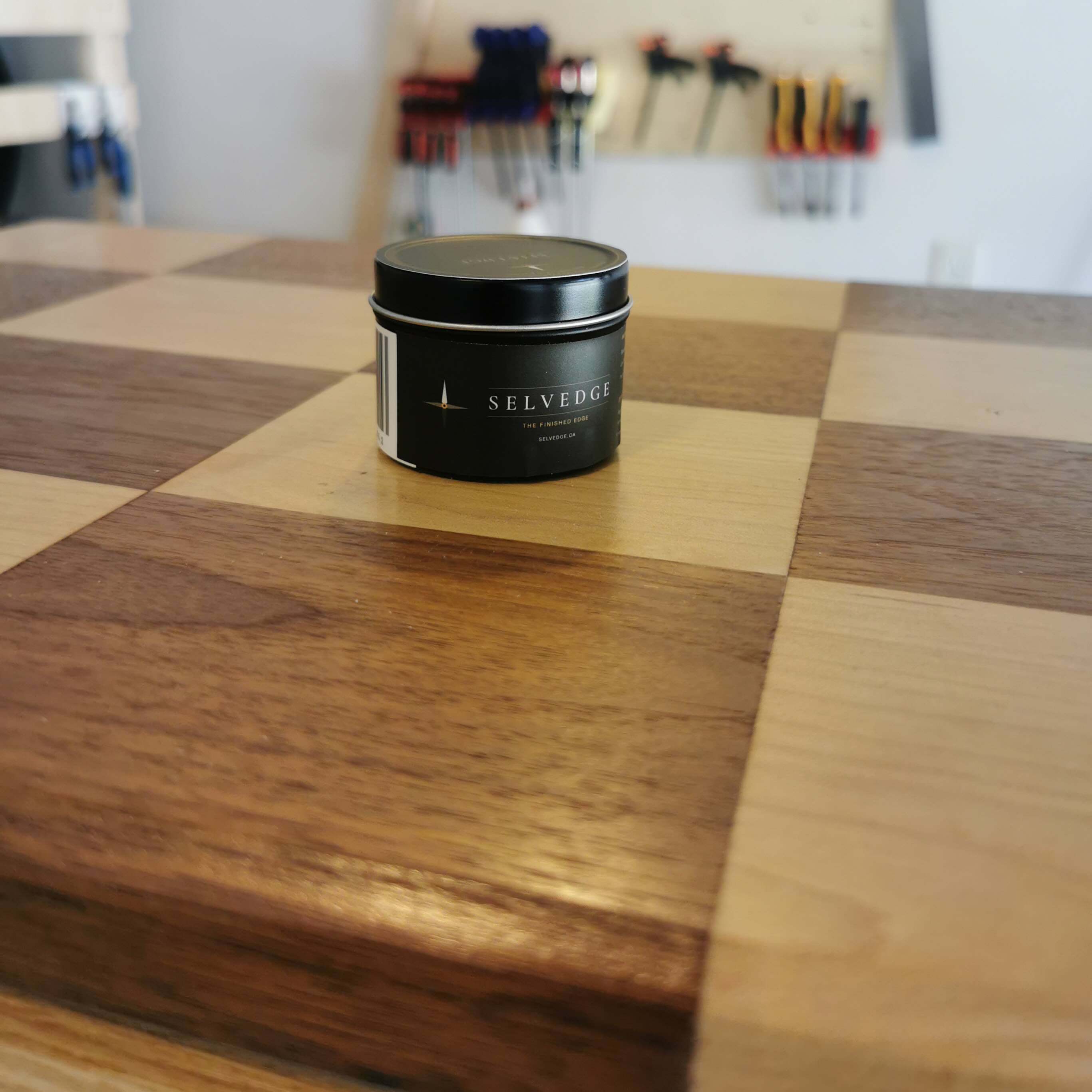 Tin on wood surface